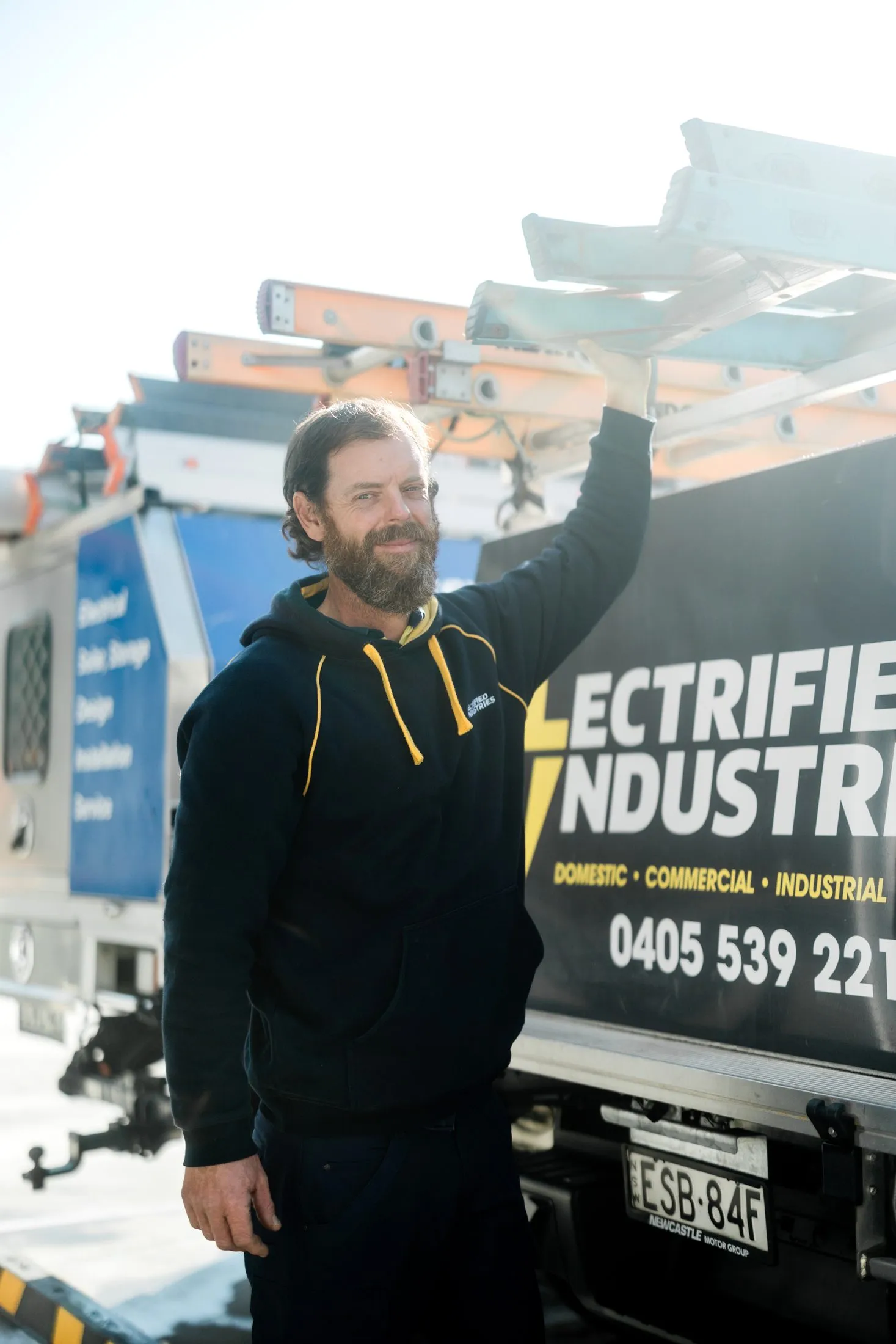 The Electrified Industries crew talking through a home battery install with a customer