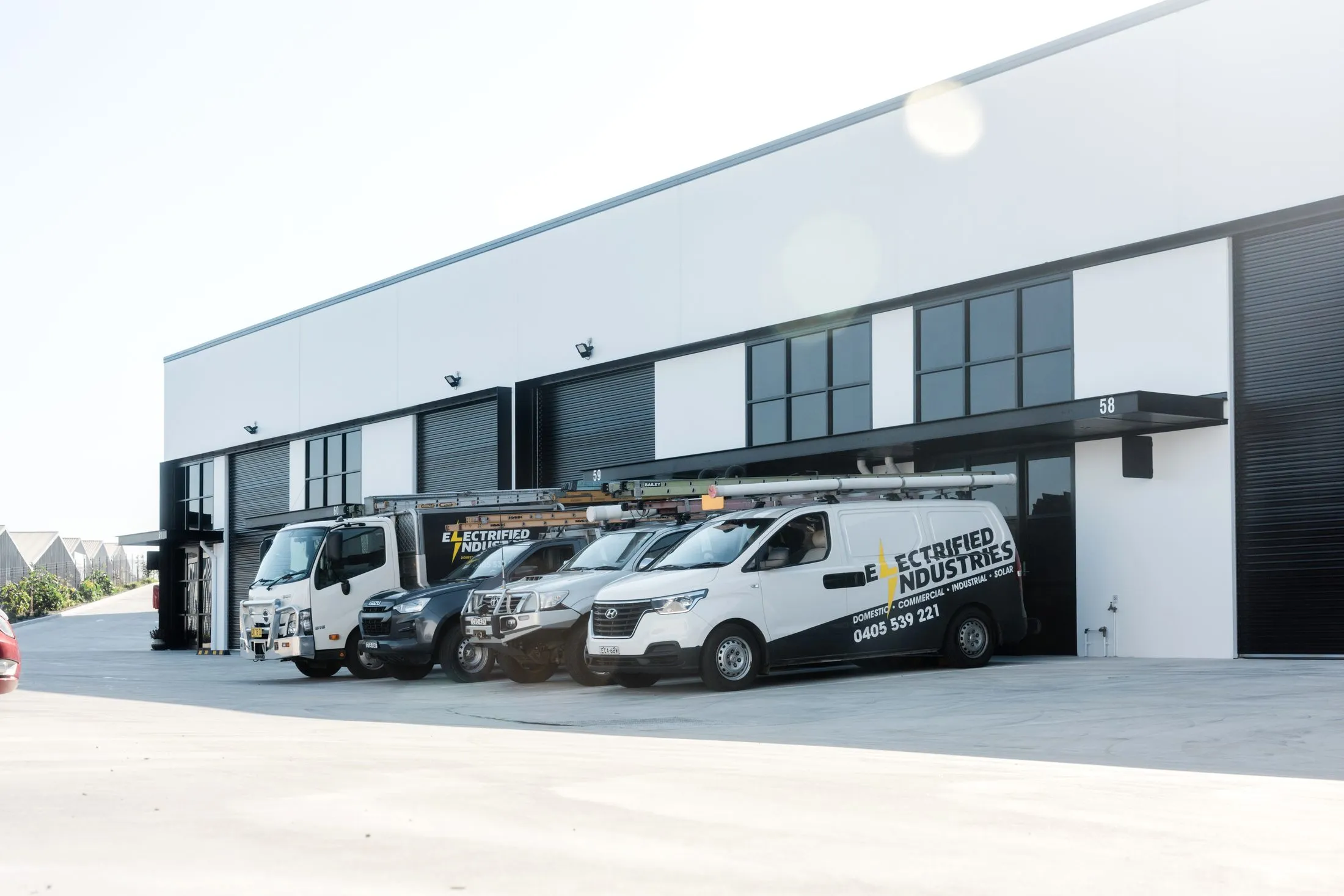 The Electrified Industries crew and vans ready for a commercial job across the Hunter