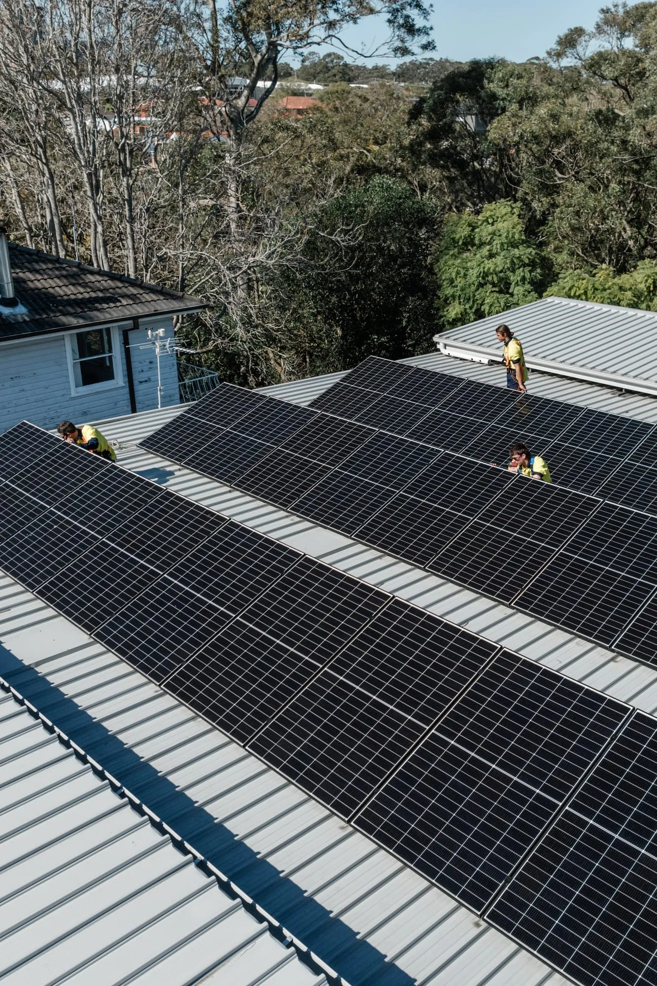 Aerial view of a completed rooftop solar array on a Newcastle home