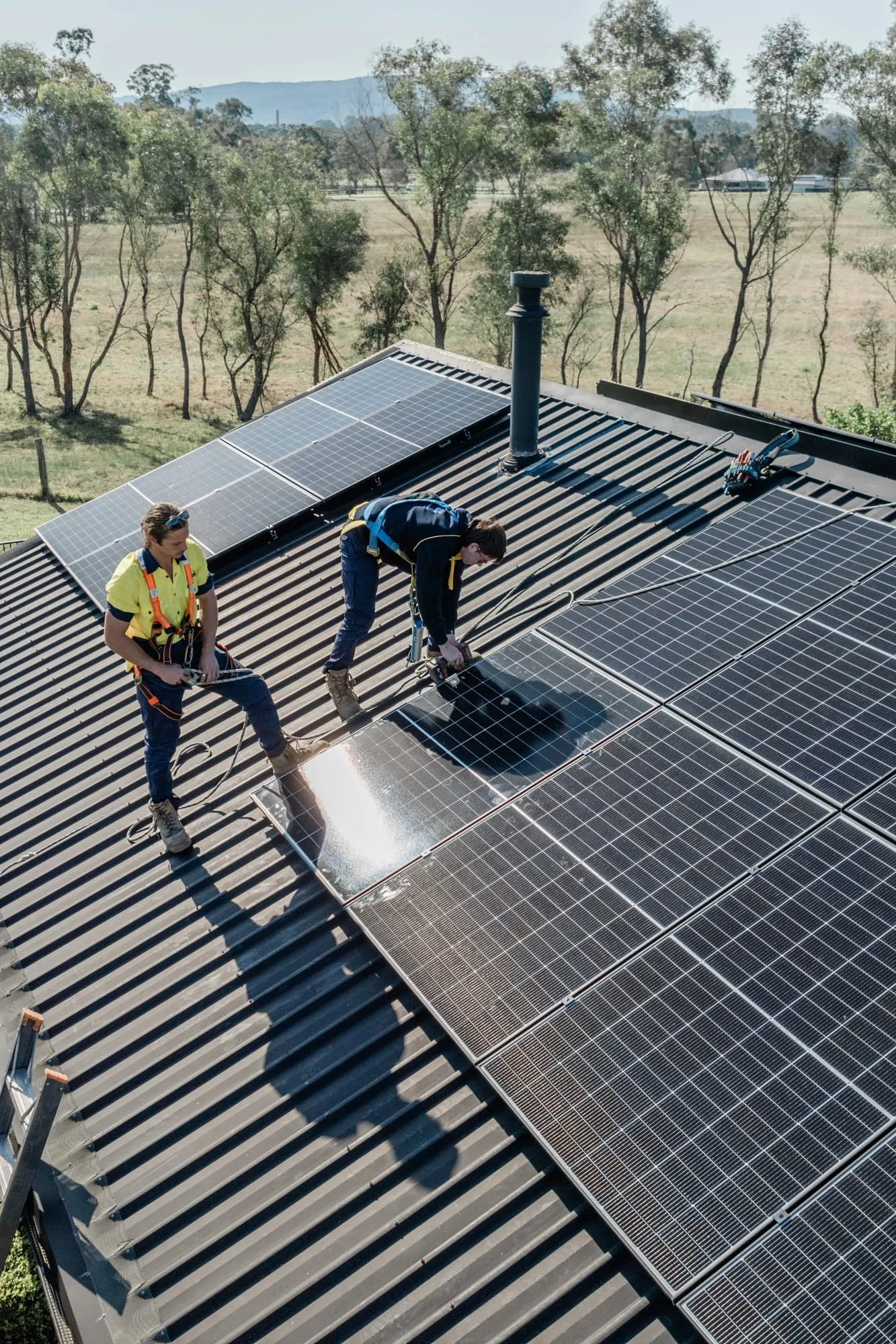 Electrified Industries servicing a rooftop solar array in the Hunter